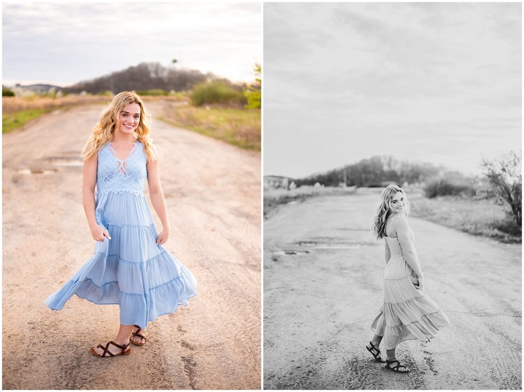 Blonde girl on a dirt road wearing a light blue dress with sandals.